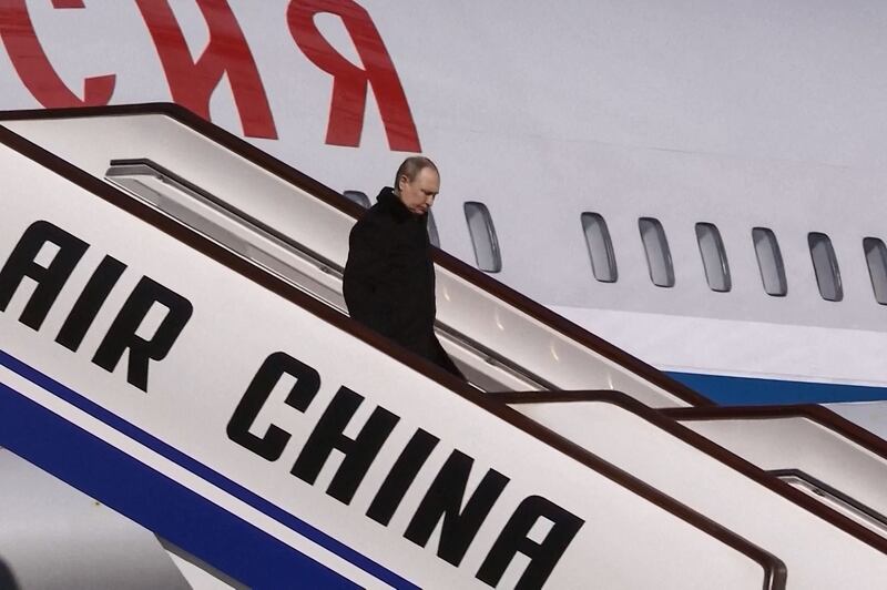 Russian President Vladimir Putin disembarks upon his arrival in Beijing on Friday, ahead of his meeting with Chinese President Xi Jinping and the opening ceremony of the 2022 Winter Olympic Games. AFP