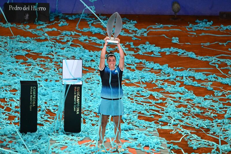 Ons Jabeur lifts the Madrid Open trophy after beating Jessica Pegula in the final. AFP