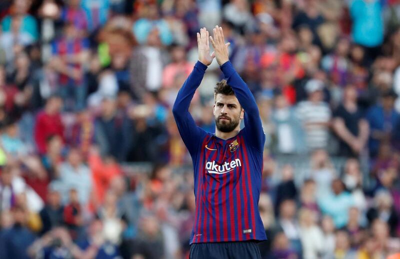 Gerard Pique applauds the fans after the game. Reuters