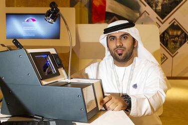 Emirati inventor Amer Al Jabri with his cost-effective 7E passport reading machine. Christopher Pike / The National