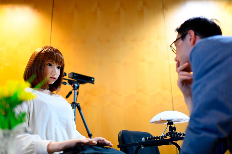 A robot created by Japan's Hiroshi Ishiguro Laboratories called Erica (L) is presented at the IROS 2018 International Conference on Intelligent Robots on October 5, 2018 in Madrid.   / AFP / GABRIEL BOUYS                    
