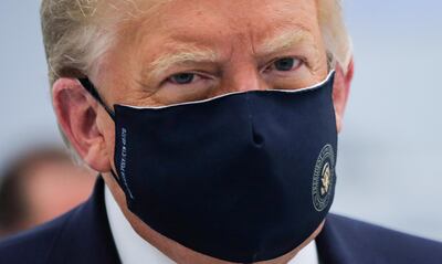 U.S. President Donald Trump wears a protective face mask during a tour of the Fujifilm Diosynth Biotechnologies' Innovation Center, a pharmaceutical manufacturing plant where components for a potential coronavirus disease  (COVID-19) vaccine candidate are being developed, in Morrrisville, North Carolina, U.S., July 27, 2020. REUTERS/Carlos Barria