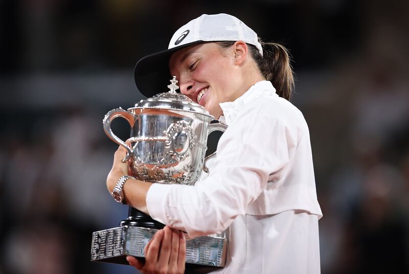  Iga Swiatek of Poland celebrates with the trophy. Getty