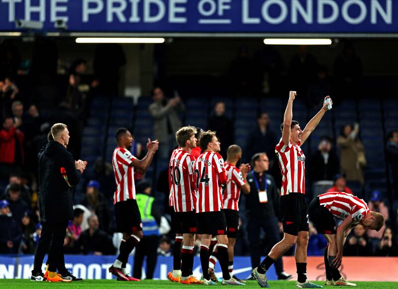 Brentford players celebrate their win against Chelsea at the final whistle. AFP