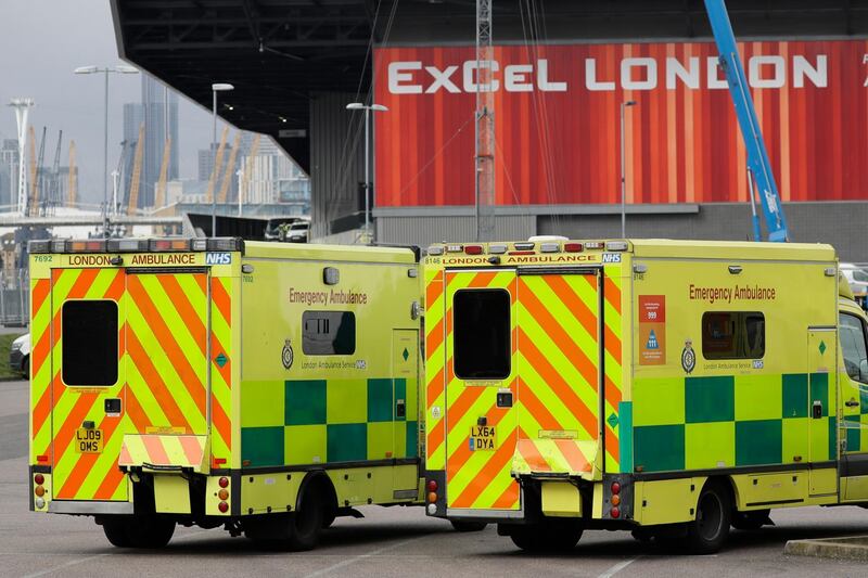 A line of London ambulances outside the ExCel center, which is being turned into a 4000 bed temporary hospital to deal with coronavirus patients in London. AP