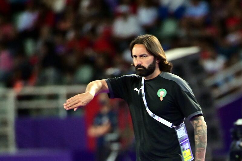 Morocco's head coach Reynald Pedros gives instructions from the sidelines.