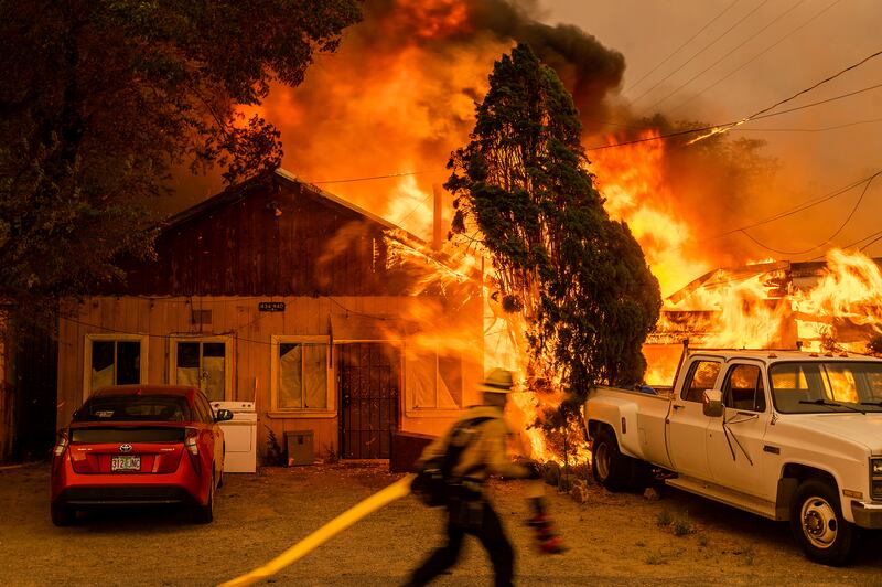Fire consumes a home in Doyle, California.