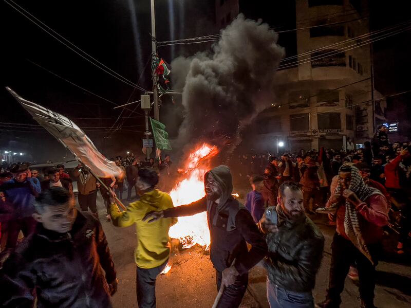 Palestinians on the streets of Gaza after news of a shooting attack near a synagogue in Jerusalem. At least seven people were killed in the attack. EPA

