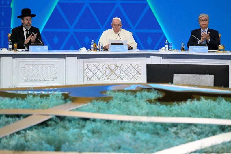 The Pope is applauded by other religious leaders. Reuters