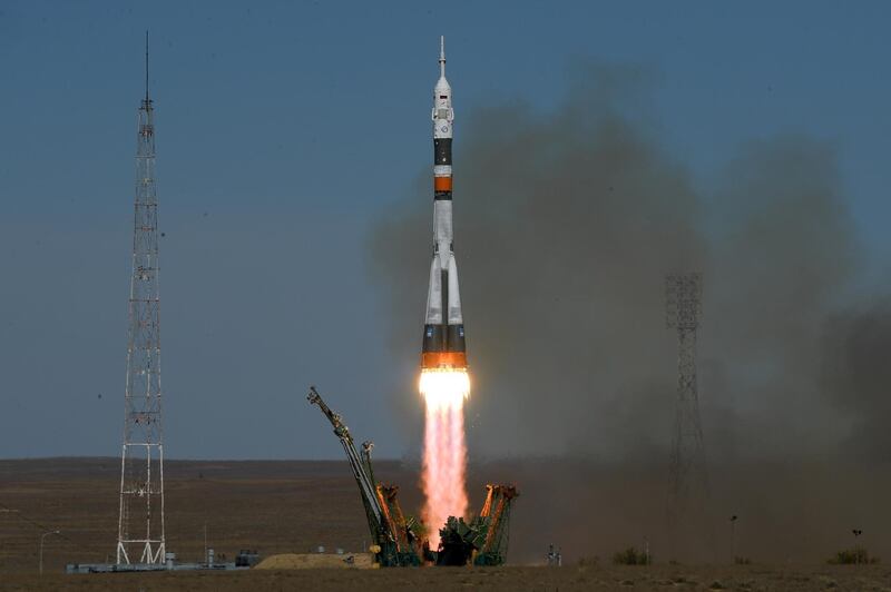 The Soyuz spacecraft carrying the members of the ISS expedition blasts off from the launch pad. AFP