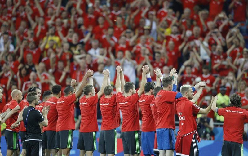 Wales' players salute their fans at the end of the Euro 2016 semifinal soccer match between Portugal and Wales, at the Grand Stade in Decines-Charpieu, near Lyon, France, Wednesday, July 6, 2016. Portugal won 2-0. (AP Photo/Frank Augstein)