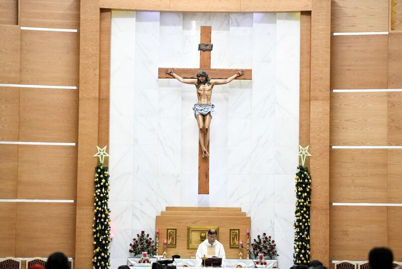Abu Dhabi, United Arab Emirates - Father Cardoza conducts midnight mass at St. PaulÕs Catholic Church in Mussafah. Khushnum Bhandari for The National