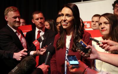 Leader of the Labour Party Jacinda Ardern (C) has photos with supporters at a Labour Party rally ahead of New Zealand's general election next week, in Hamilton on September 17, 2017 .
New Zealand's charismatic opposition leader Ardern rallied support for the final week of a rollercoaster election campaign that has her centre-left Labour Party within sight of an unlikely victory. / AFP PHOTO / MICHAEL BRADLEY