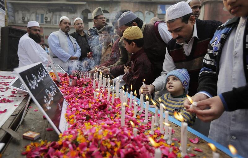 Indian Muslims pay tribute to Indian soldiers killed in the recent attack on an air force base in Pathankot. Altaf Qadri / AP Photo