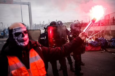 Striking labour union members and employees of an incineration plant block its entrance in Ivry-sur-Seine, outside Paris. EPA 