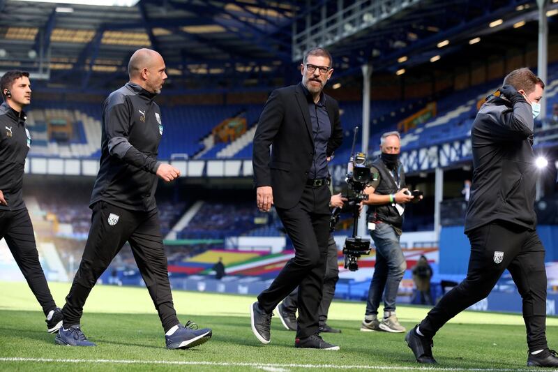 West Bromwich Albion's manager Slaven Bilic, centre, leaves the pitch after being shown a red card. AP