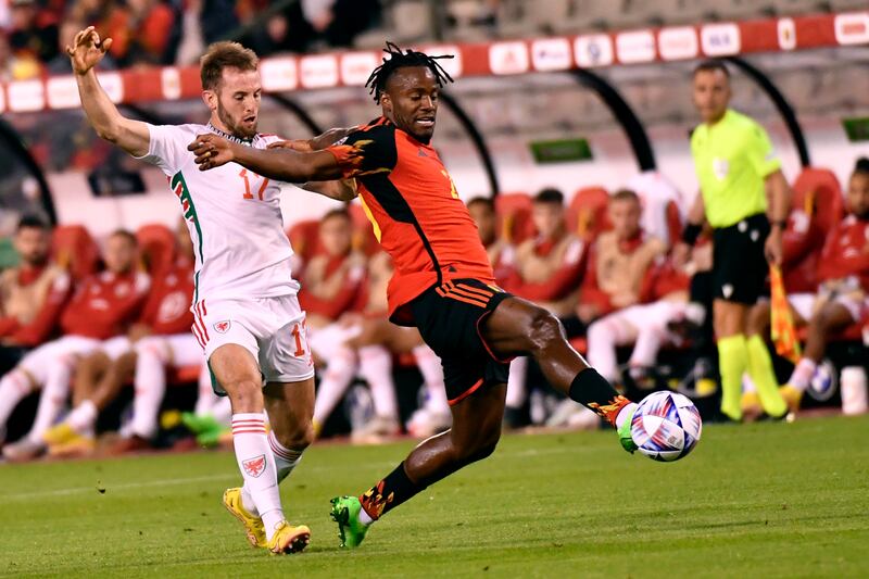 Belgium's Michy Batshuayi, right, fights for the ball against Wales' Rhys Norrington-Davies. AP