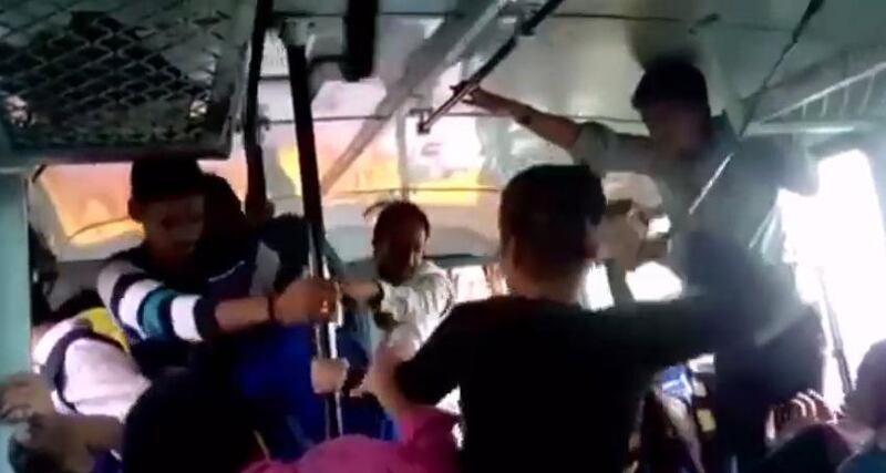 Screengrab of two Indian sisters attacking three of their alleged molesters on a moving bus. The video on Youtube sparked strong reactions in India.