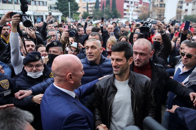 Budva's Mayor Marko Bato Carevici greets Serbian tennis star Novak Djokovic in Montenegro on Friday, January 28, 2022. Reuters