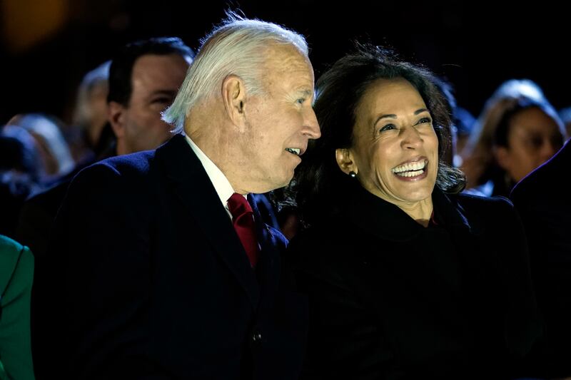 Mr Biden and Vice President Kamala Harris enjoy a laugh during the ceremony. AP