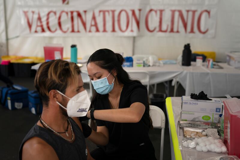 A nurse administers a Covid-19 vaccine at a clinic in Orange, California. AP