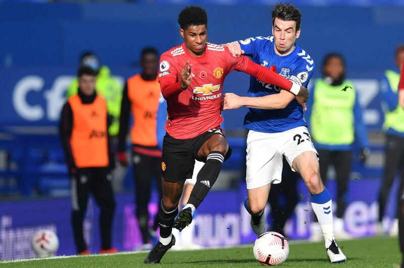 Manchester United's Marcus Rashford, left, fights for the ball with Everton's Seamus Coleman. AP