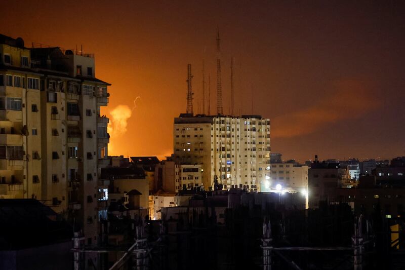Smoke rises amid buildings during Israeli air strikes in Gaza. Reuters
