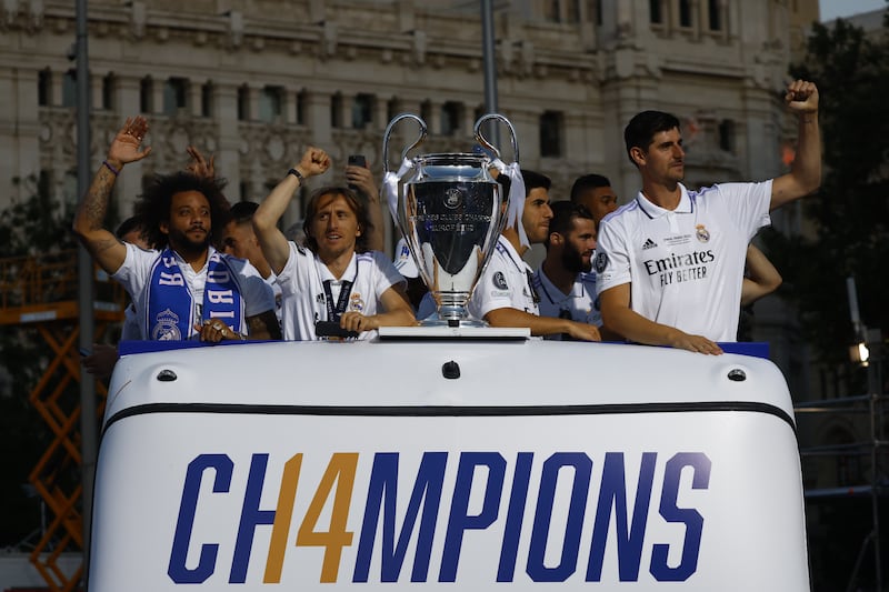 Real Madrid players Marcelo, Luka Modric, Marco Asensio, and goalkeeper Thibaut Courtois during an open top bus parade. EPA