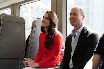Prince William and Kate, Princess of Wales, travel on London Underground's Elizabeth Line in central London. AP 
