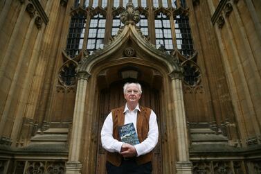 British author Philip Pullman poses with a copy of 'La Belle Sauvage: The Book of Dust Volume One' at the Bodleian Libraries, in Oxford, southern England. AFP 