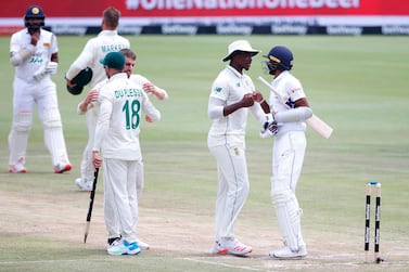 Sri Lanka's Kasun Rajitha congratulates Lungi Ngidi, second right, after South Africa won the first Test in Centurion. AFP