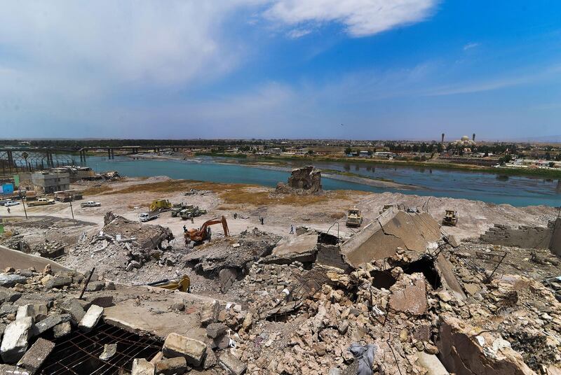The ruins of buildings destroyed during the battle for Mosul, on the shore in the Tigris river. AFP