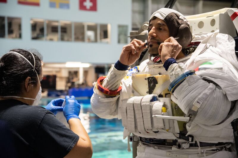 Sultan Al Neyadi wears his EVA suit for spacewalk training in the indoor pool. He will perform the first spacewalk by an Arab astronaut on April 28, 2023. Photo: MBRSC 