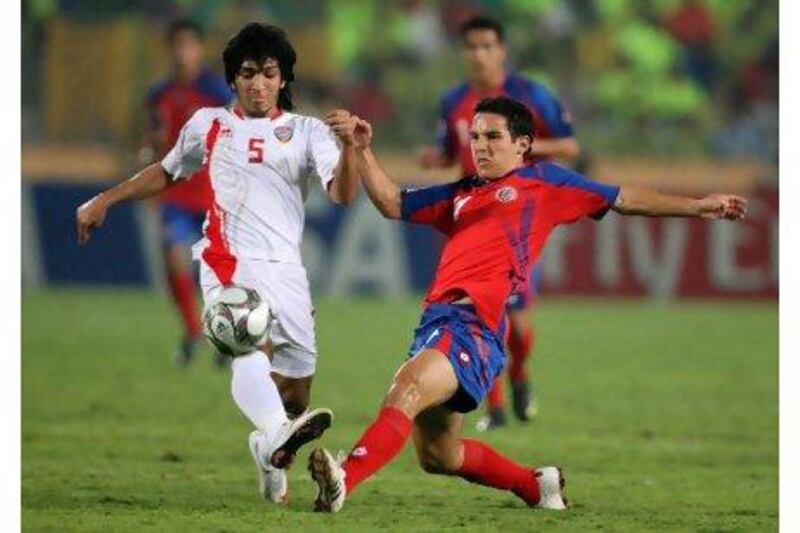United Arab Emirates' Amer Abdulrahman, left, fights for the ball with Costa Rica's Diego Madrigal during their U-20 World Cup quarter final soccer match at the Cairo International Stadium, in Cairo, on Saturday, Oct. 10, 2009. (AP Photo/Thanassis Stavrakis) *** Local Caption *** XTS116_Egypt_United_Arab_Emirates_Costa_Rica_U20_Soccer.jpg