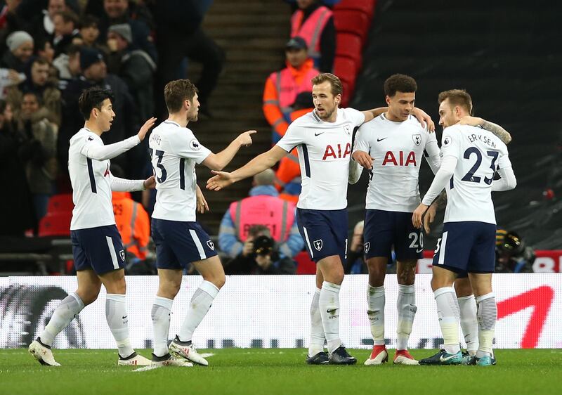 LONDON, ENGLAND - JANUARY 31:  Harry Kane of Tottenham Hotspur and Dele Alli of Tottenham Hotspur celebrate with teammates after Phil Jones of Manchester United (not pictured) scores an own goal during the Premier League match between Tottenham Hotspur and Manchester United at Wembley Stadium on January 31, 2018 in London, England.  (Photo by Steve Bardens/Getty Images)