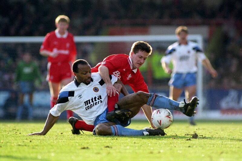 CRYILLE REGIS (VILLA) CLASHES WITH DAVID KERSLAKE (SWIN) SWINDON TOWN V ASTON VILLA FA CUP 5TH ROUND  (Photo by Ross Kinnaird/EMPICS via Getty Images)