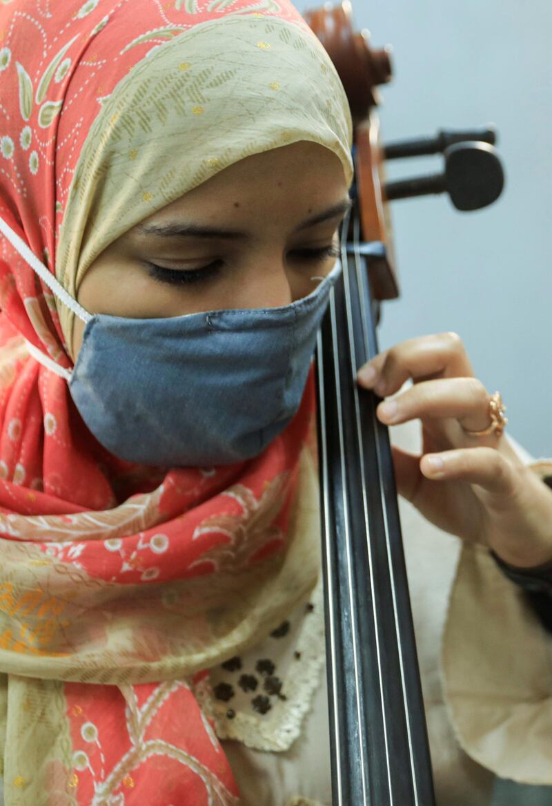 A member of Al Nour Wal Amal (Light and Hope) chamber orchestra for blind women plays during a practice session in Cairo, Egypt. Reuters
