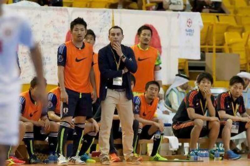 Japan's head coach Miguel Rodrigo watches his team in Dubai.