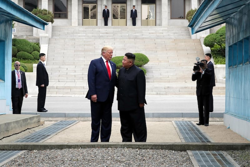 PANMUNJOM, SOUTH KOREA - JUNE 30: (SOUTH KOREA OUT): A handout photo provided by Dong-A Ilbo of North Korean leader Kim Jong Un and U.S. President Donald Trump inside the demilitarized zone (DMZ) separating the South and North Korea on June 30, 2019 in Panmunjom, South Korea. U.S. President Donald Trump and North Korean leader Kim Jong-un briefly met at the Korean demilitarized zone (DMZ) on Sunday, with an intention to revitalize stalled nuclear talks and demonstrate the friendship between both countries. The encounter was the third time Trump and Kim have gotten together in person as both leaders have said they are committed to the "complete denuclearization" of the Korean peninsula. (Photo by Handout/Dong-A Ilbo via Getty Images)