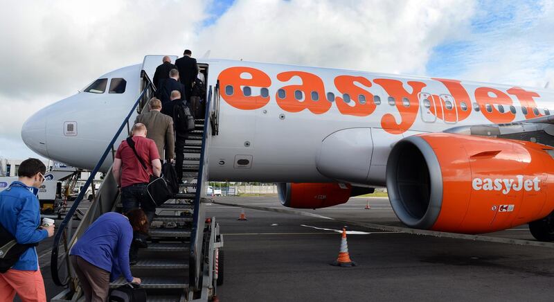 epa07477990 (FILE) - Passengers board an airplane of low cost carrier Easyjet in Belfast, Northern Ireland, Britain, 19 June 2013 (reissued 01 April 2019). Easyjet on 01 April 2019 said the demand for their tickets for the months from April to September 2019 is exceptionally weak, causing its shares to drop in trading early Monday. Easyjet referred to 'softness in  UK and Europe and unanswered questions surrounding the Brexit' outcome, both seen as factors for weak demand.  EPA/ANDY RAIN