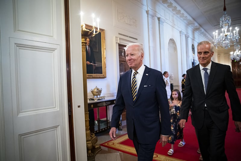 Mr Biden and Denis McDonough, Secretary of Veterans Affairs, enter the East Room of the White House for the signing ceremony. Bloomberg 