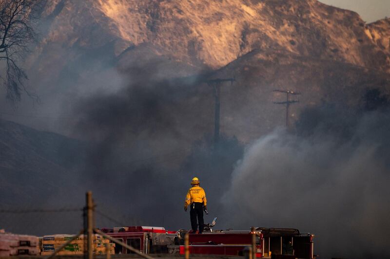 Firefighters work at extinguishing the Tick Fire in a factory near Santa Clarita. EPA