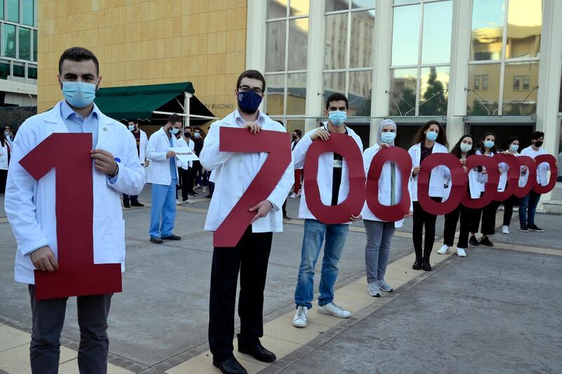 Medical students at the American University of Beirut (AUB) shout slogans during a protest against the adjustment of the dollar rate for new tuition fees in Beirut, Lebanon. EPA