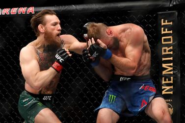 LAS VEGAS, NEVADA - JANUARY 18: Conor McGregor (L) punches Donald Cerrone in a welterweight bout during UFC246 at T-Mobile Arena on January 18, 2020 in Las Vegas, Nevada. McGregor won by first-round TKO. Steve Marcus/Getty Images/AFP