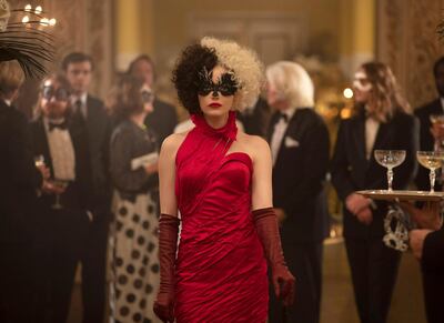 This image released by Disney shows Emma Stone in a scene from "Cruella." Costumes for the film were designed by Oscar winning designer Jenny Beavan. (Laurie Sparham/Disney via AP)