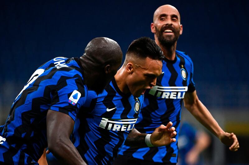 Inter Milan's Lautaro Martinez celebrates with Inter Milan's Belgian forward Romelu Lukaku. AFP