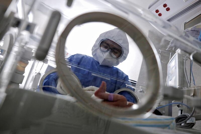 A nurse changes the diaper of a newborn baby infected with Covid-19 at the coronavirus neo-natal unit of the Maternal Perinatal Hospital "Monica Pretelini Saenz," in Toluca, Mexico. Reuters