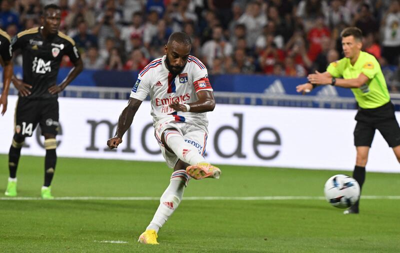 Lyon's French forward Alexandre Lacazette kicks to score his team's second goal on a penalty during the French Ligue 1 football match between Olympique Lyonnais (OL) and Ajaccio at The Groupama Stadium in Decines-Charpieu, central-eastern France, on August 5, 2022.  (Photo by JEAN-PHILIPPE KSIAZEK  /  AFP)