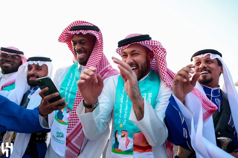 Brazilian football star Neymar in traditional Saudi dress celebrates Saudi Arabia's 93rd National Day with fellow members of Riyadh's Al Hilal Football Club. Reuters