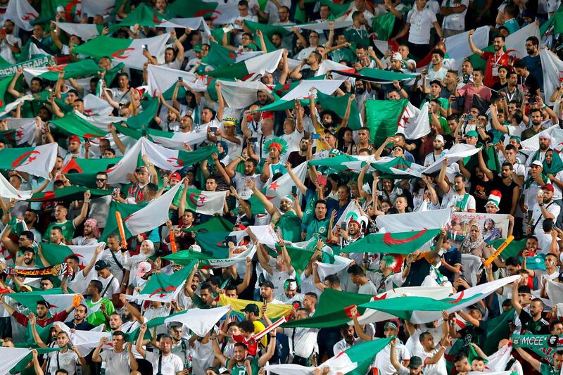 Algeria supporters cheer their team on at the Cairo International Stadium in Egypt. AFP